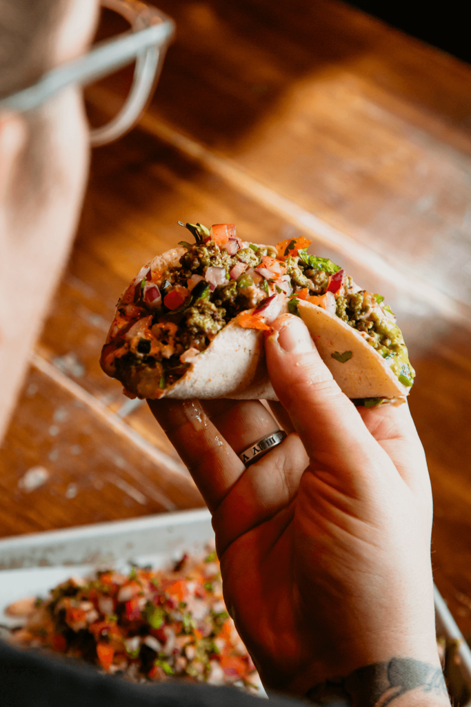 Man eating tacos